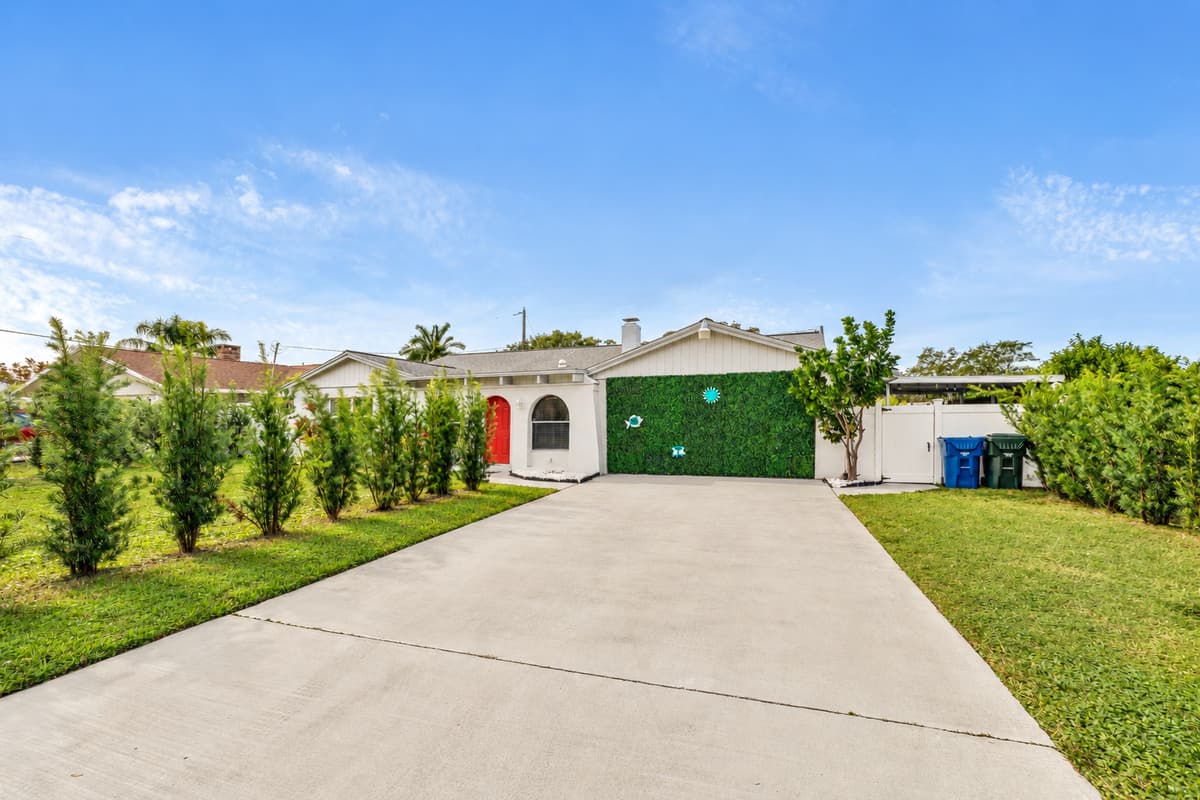 The grandeur of the design is complemented by an expansive driveway.