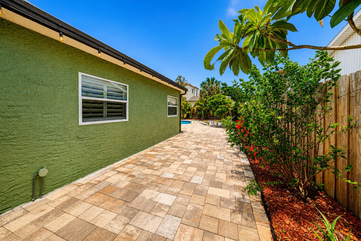Spacious side walkway providing easy access around the property and outdoor areas.