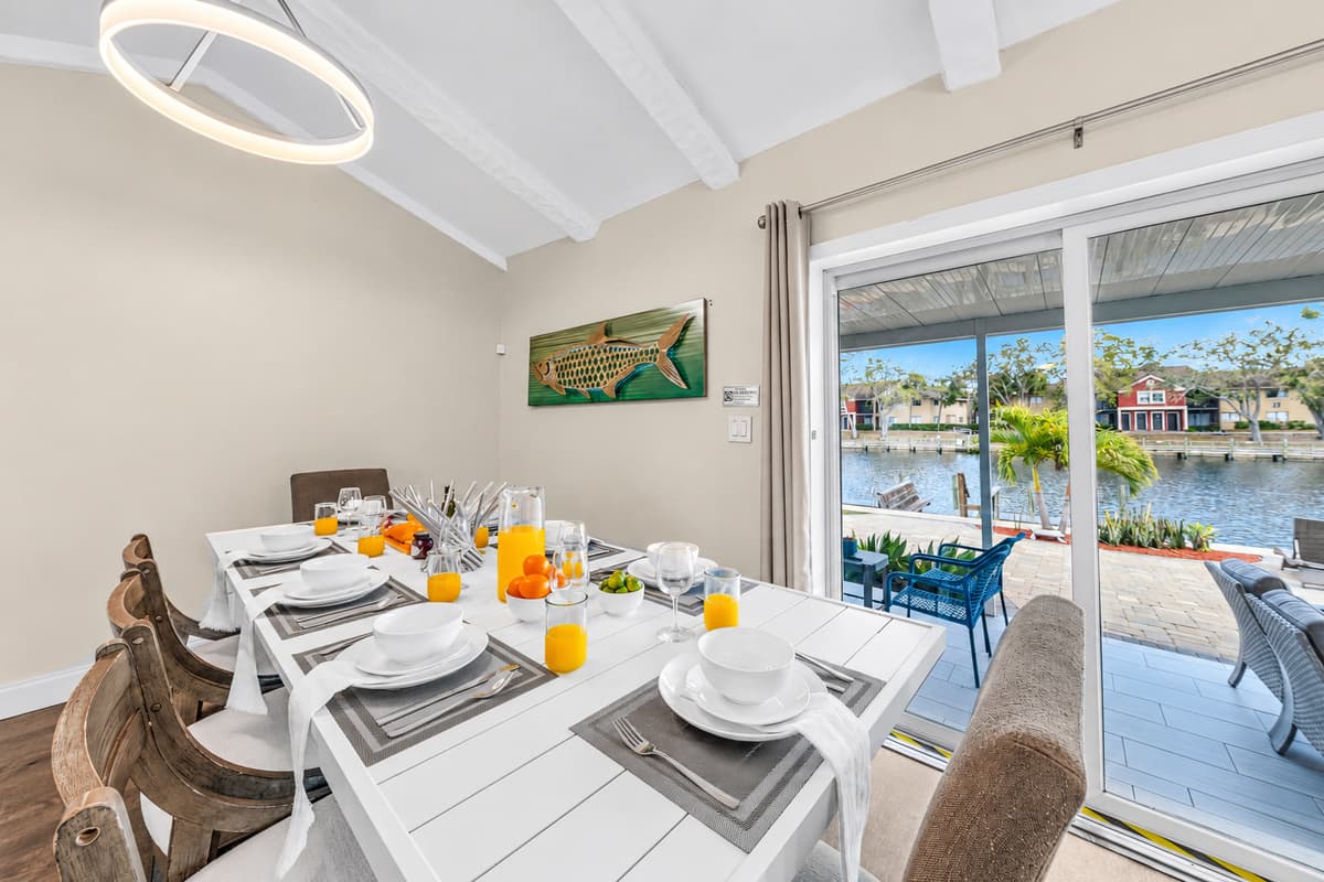 Dine with beautiful waterfront views through large sliding glass doors.