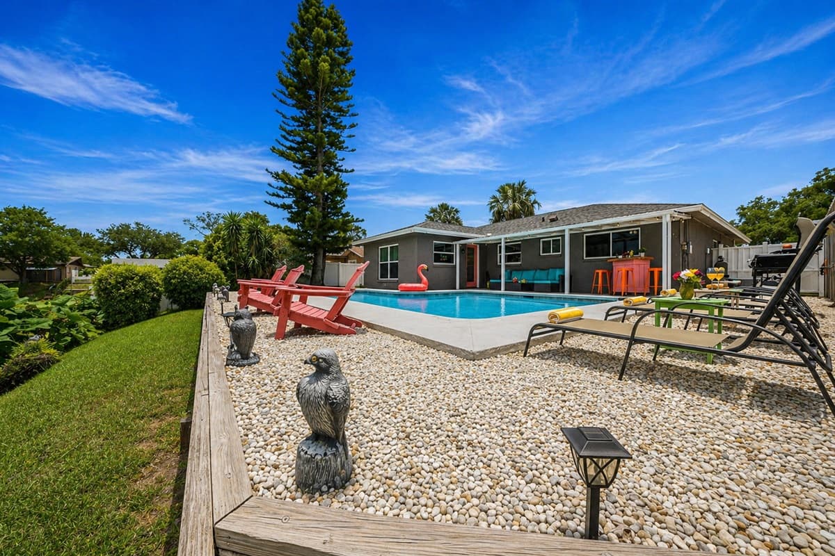 Expansive outdoor area with seating, pool, and plenty of space to unwind or gather.