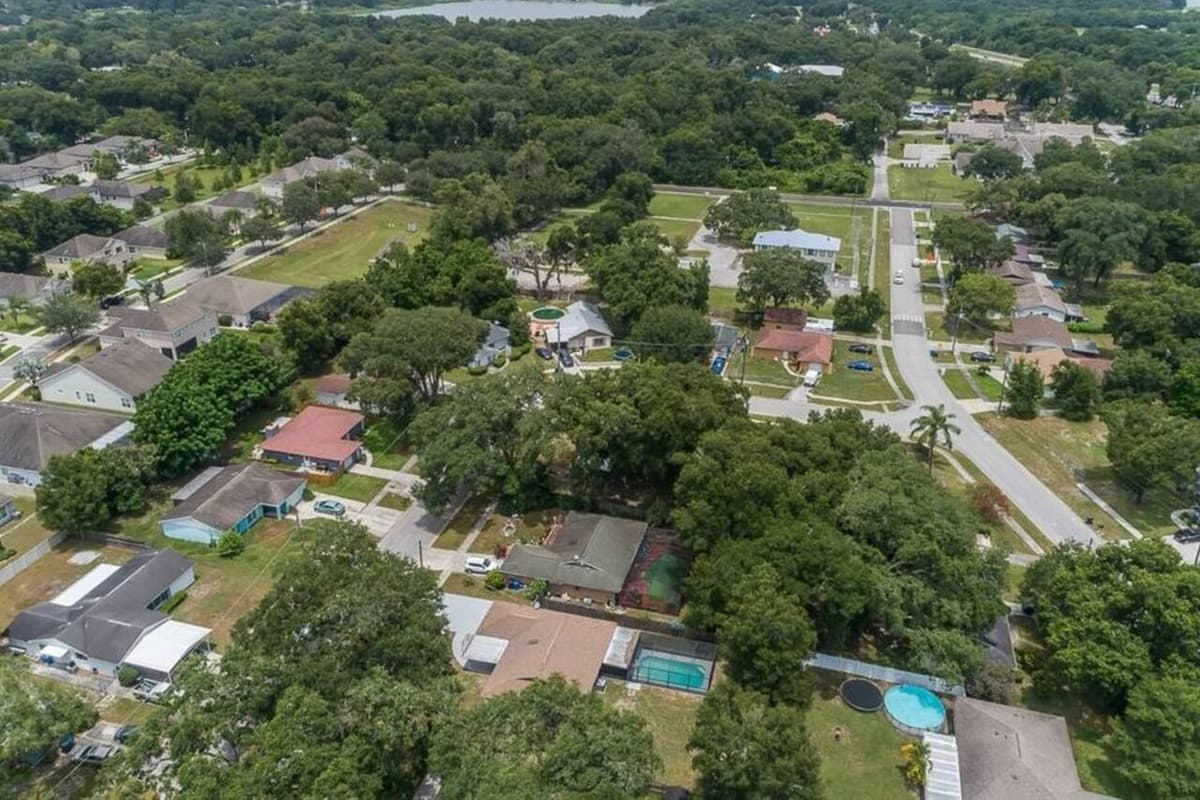 Do you love nature? Check our neighborhood's aerial view! It showcases the beautiful trees and amazing lakes in the area. If you are interested in what you see, send us an inquiry as soon as possible!