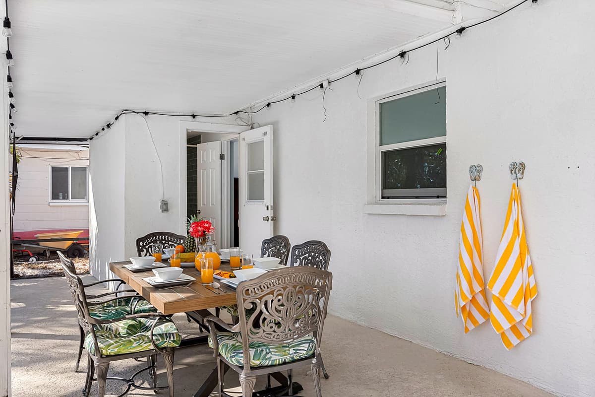 Featuring a sturdy outdoor dining table with ample seating, allowing everyone to dine together in style.