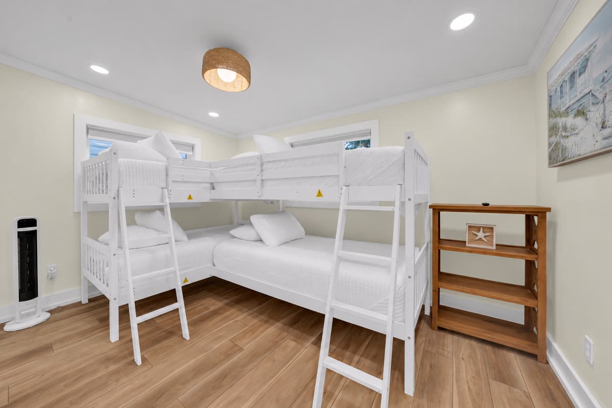 The bunk room kids will fight over. Two twin-over-twin bunk beds give four sleeping spots in one fun room. Fresh white bedding, a TV and storage shelves for their gear.