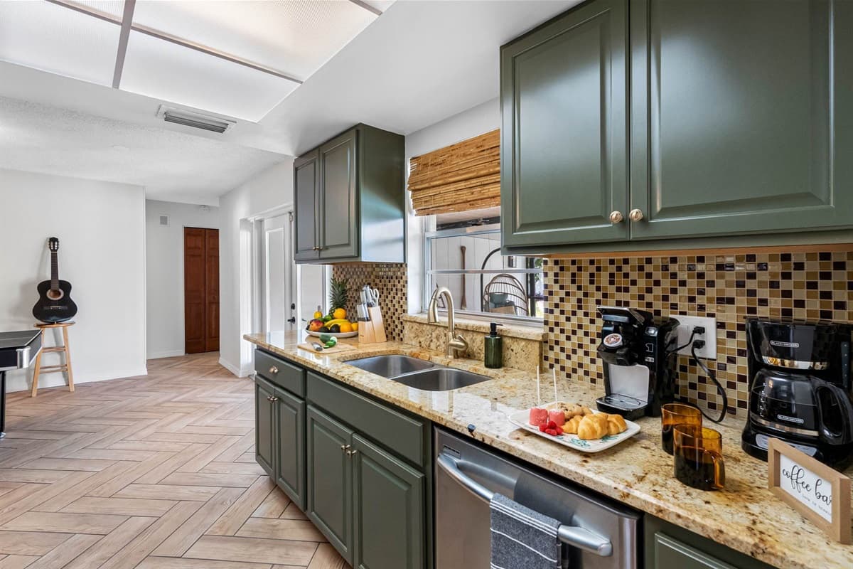 A chef-friendly space with everything you need: full-size stainless oven, spacious fridge with ice/water dispenser, and smart storage throughou