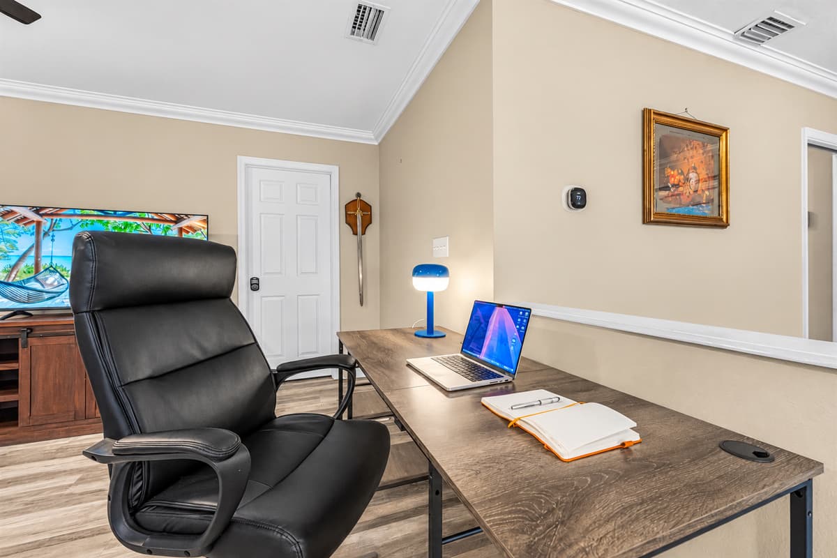 Dedicated workspace with desk, comfortable chair, and open view—perfect for remote work or planning your day.
