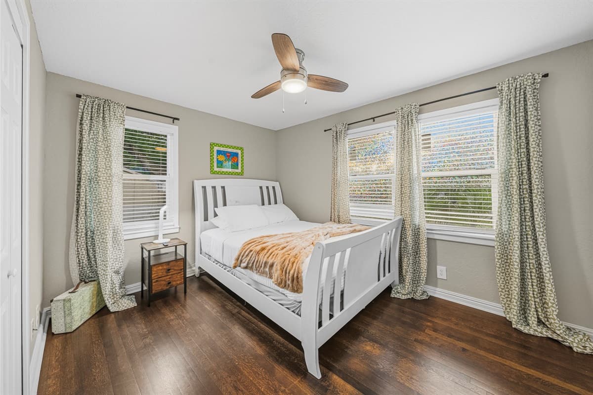 Cozy bedroom with natural light, comfortable bed, and calming decor for a restful night’s sleep.