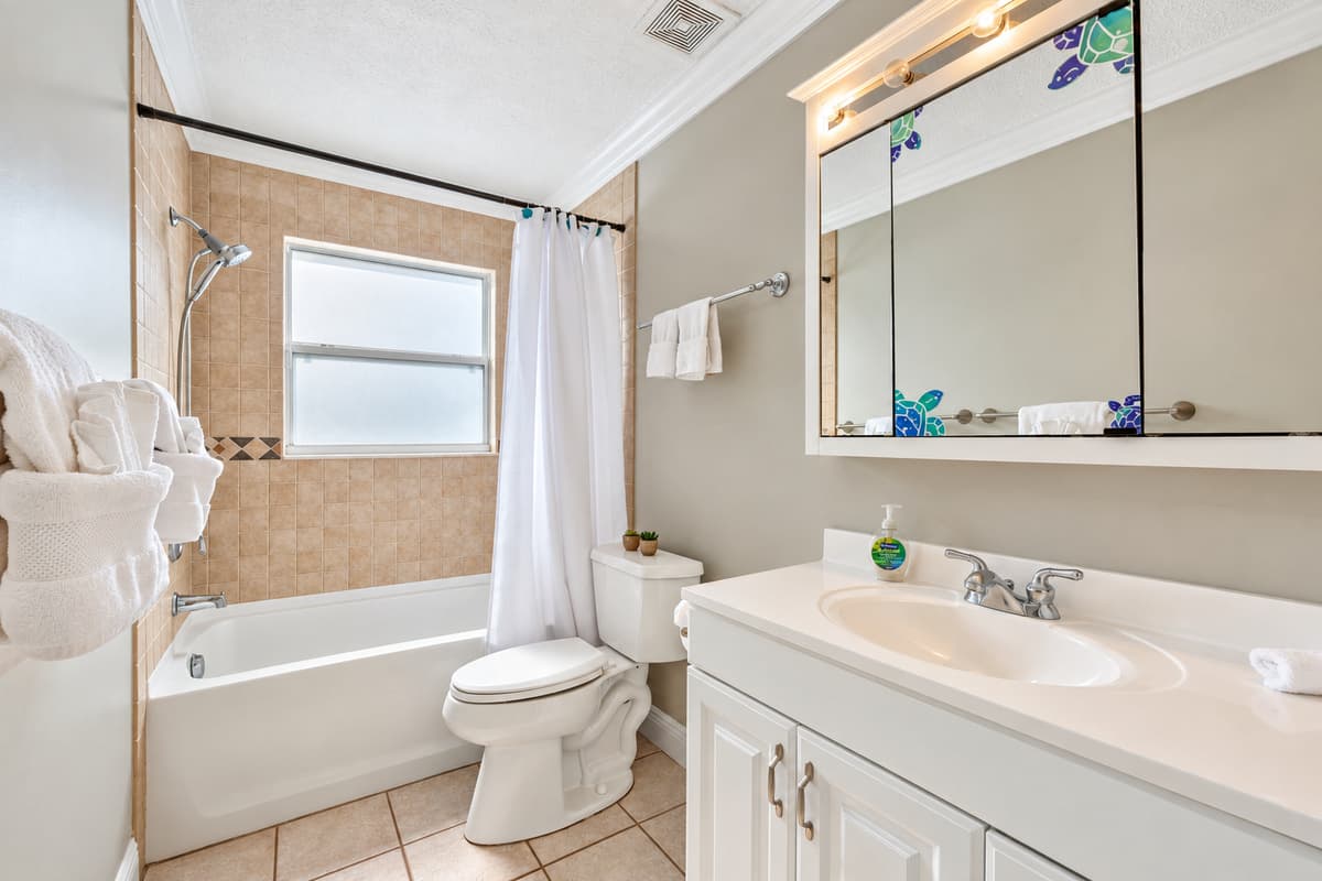 The well-lit and carefully arranged vanity mirror adds a touch of sophistication.