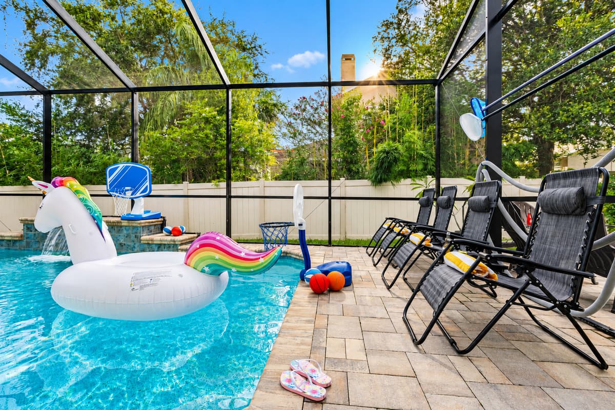 Enjoy the outdoors without the hassle—this entire pool area is enclosed with a full-screen structure, keeping bugs and debris at bay while still letting in plenty of sunlight and fresh air.