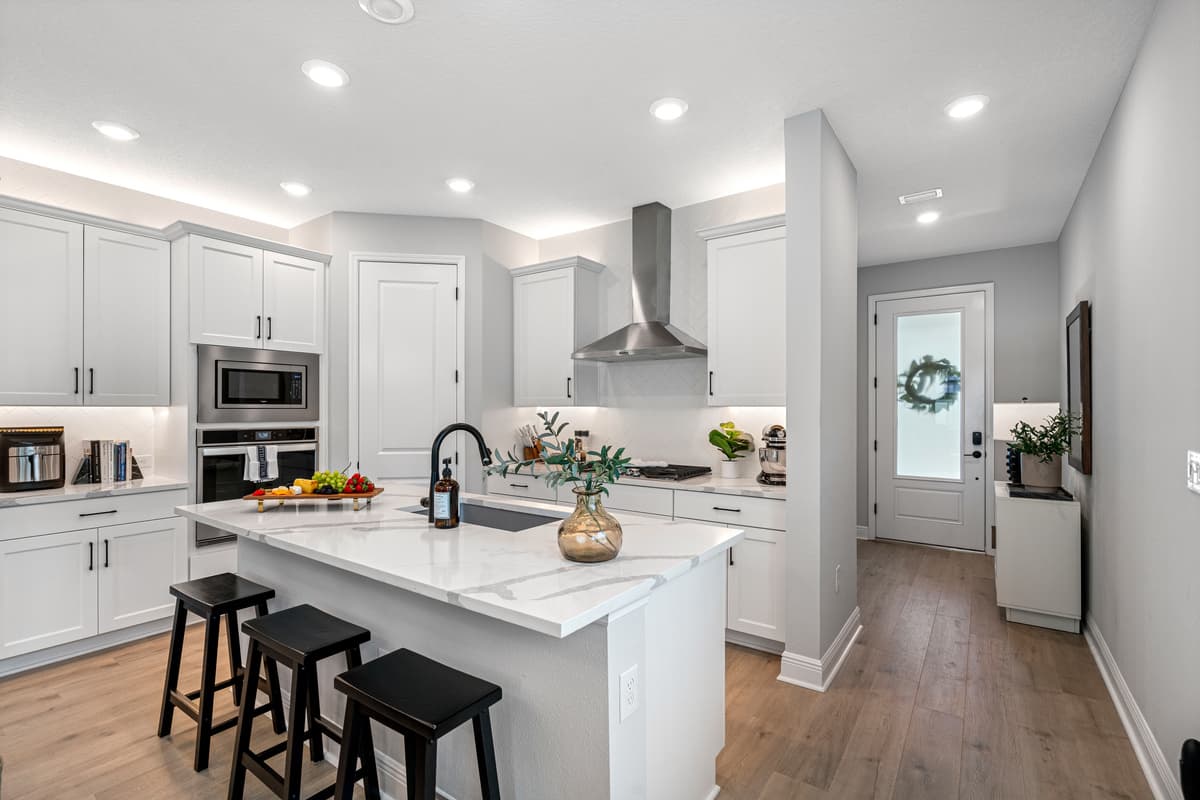 The kitchen is a stunning blend of modern elegance and functionality, designed to be the heart of the home.