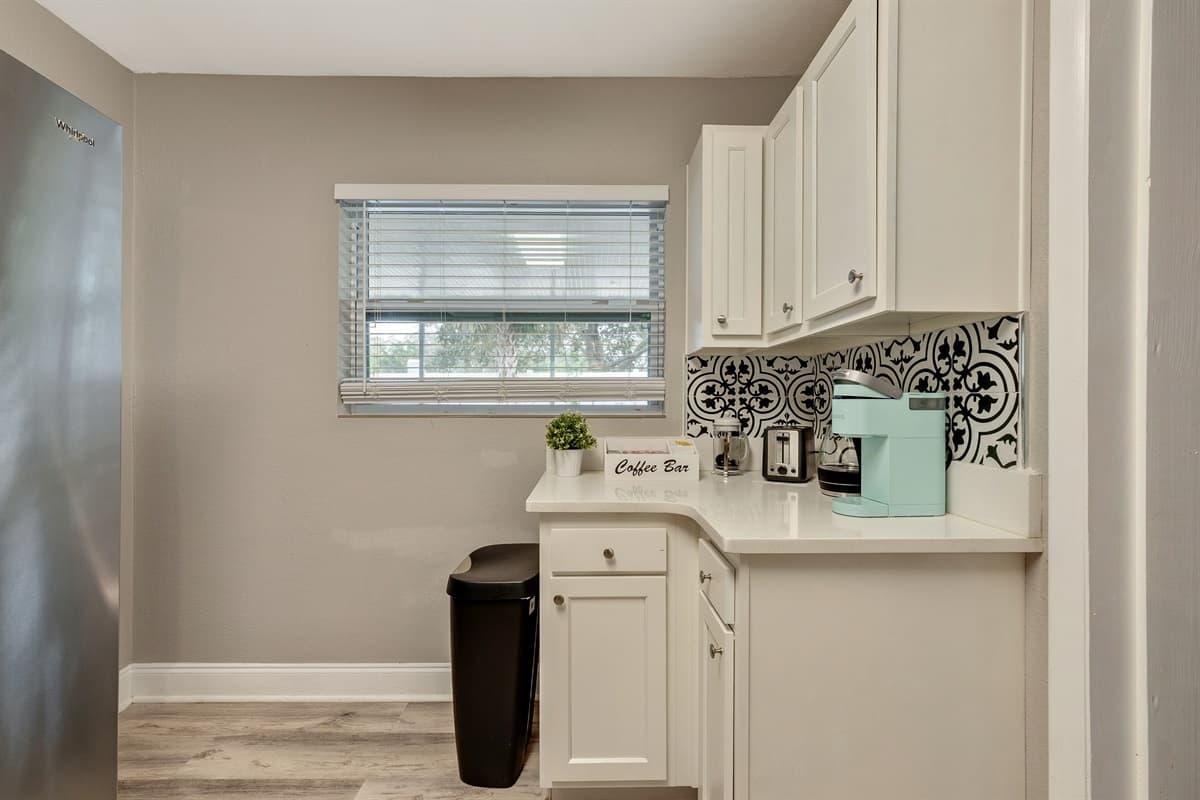 The expansive countertops offer ample space for meal preparation.