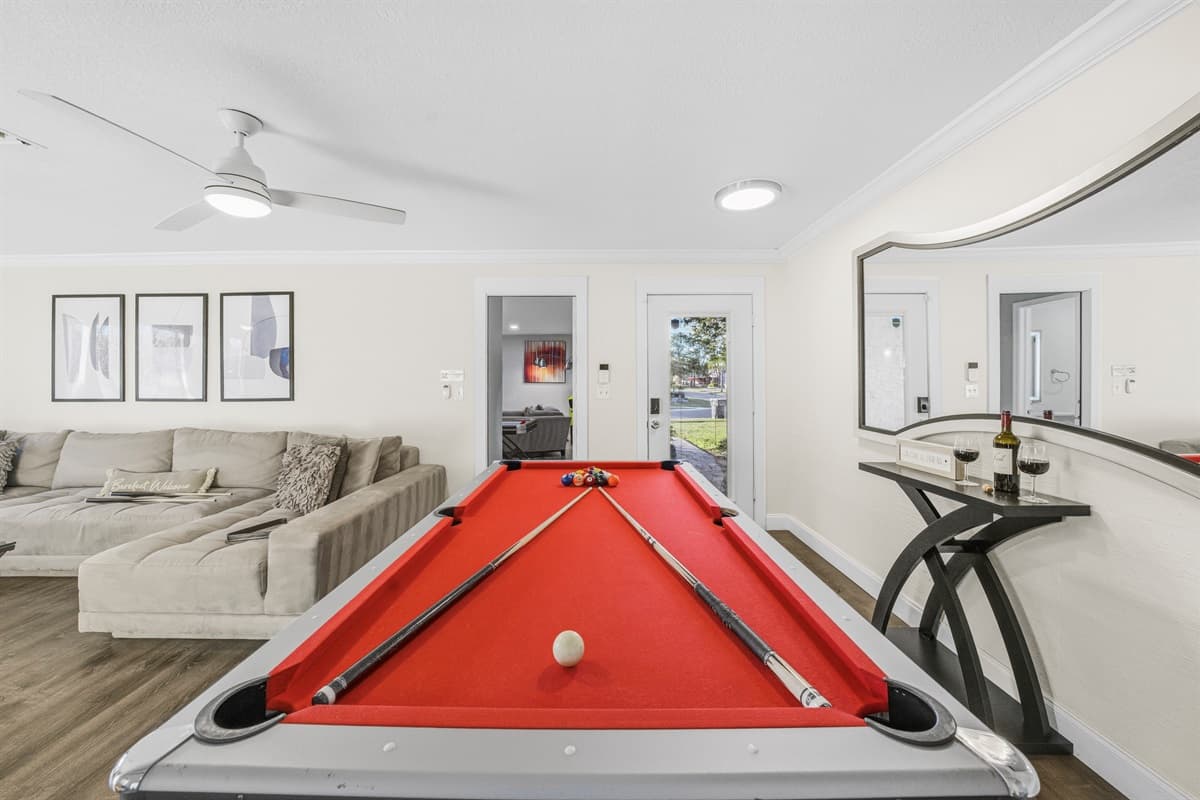 Enjoy endless fun with the pool table just steps from the living room.