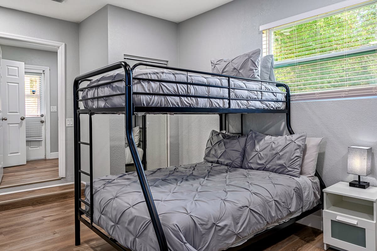 Incredible bedroom that has two single over double bunkbeds, full length mirror closet, drawers and a smart TV. Great for family with kids or an inseparable group of friends. Inquire now!