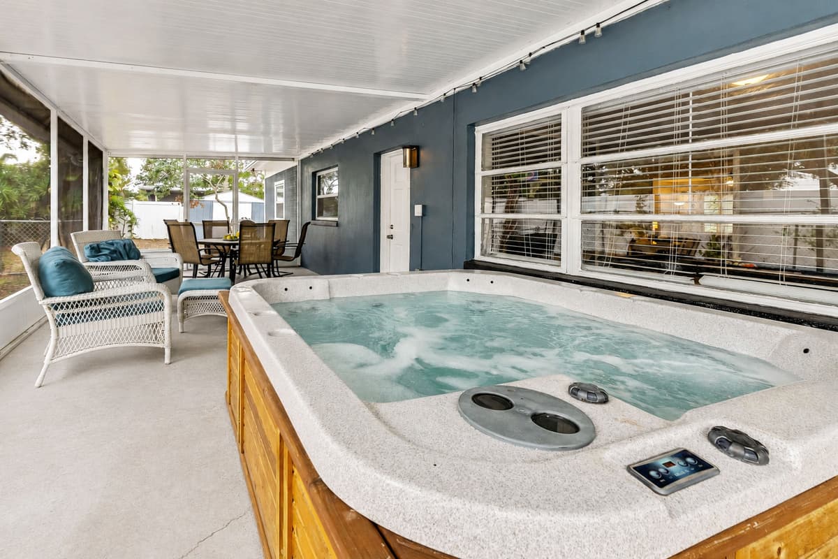 At the heart of this al fresco paradise lies the pièce de résistance—a bubbling hot tub that invites you into a symphony of relaxation.