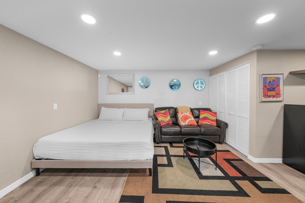 Bright and inviting living room with plush sectional seating, stylish décor, and plenty of space to relax. — photo 47