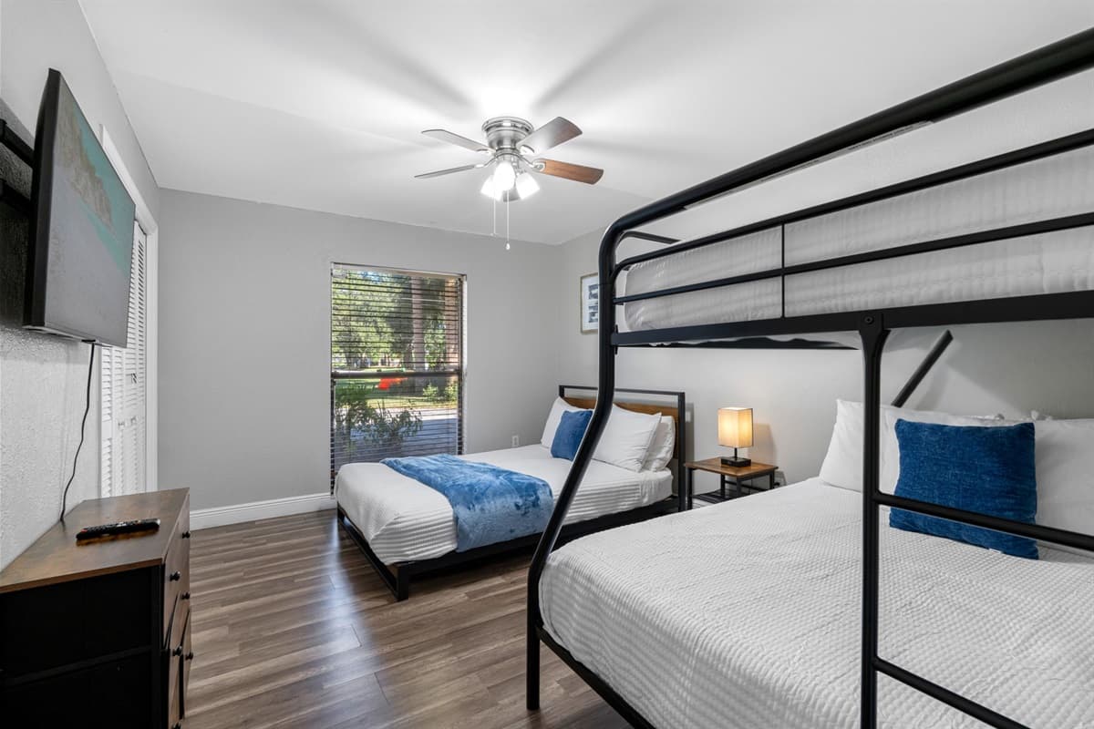 Sunlight fills this cheerful bedroom — designed for comfort and convenience for all ages.