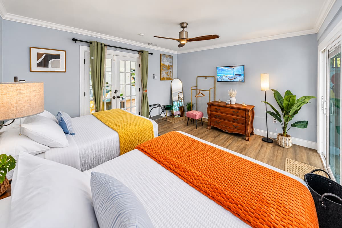 With two comfortable double beds, this bedroom is ideal for families or friends seeking a restful night’s sleep.