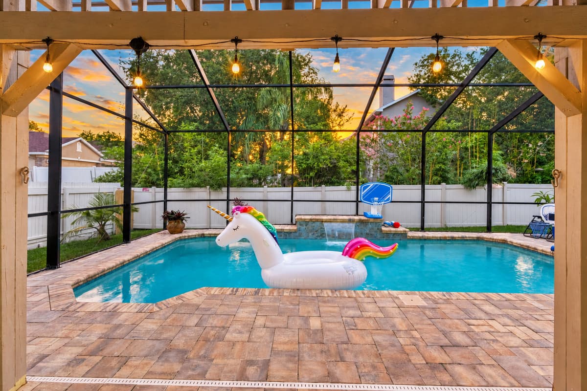 Surrounded by cozy seating, string lights, and a fully fenced yard, this pool becomes the ultimate backdrop for relaxation and celebration.