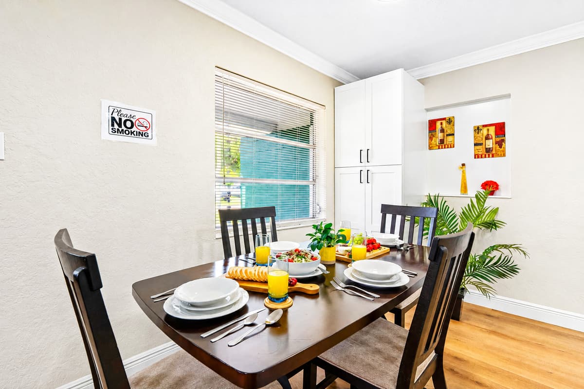 Gather, share, and savor meals in the welcoming dining area, thoughtfully positioned between the kitchen and living room for both convenience and connection.