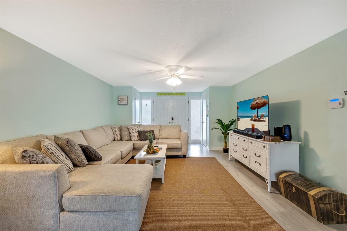 The color palette, dominated by soothing grey tones, adds a touch of sophistication while maintaining a cozy and welcoming feel.