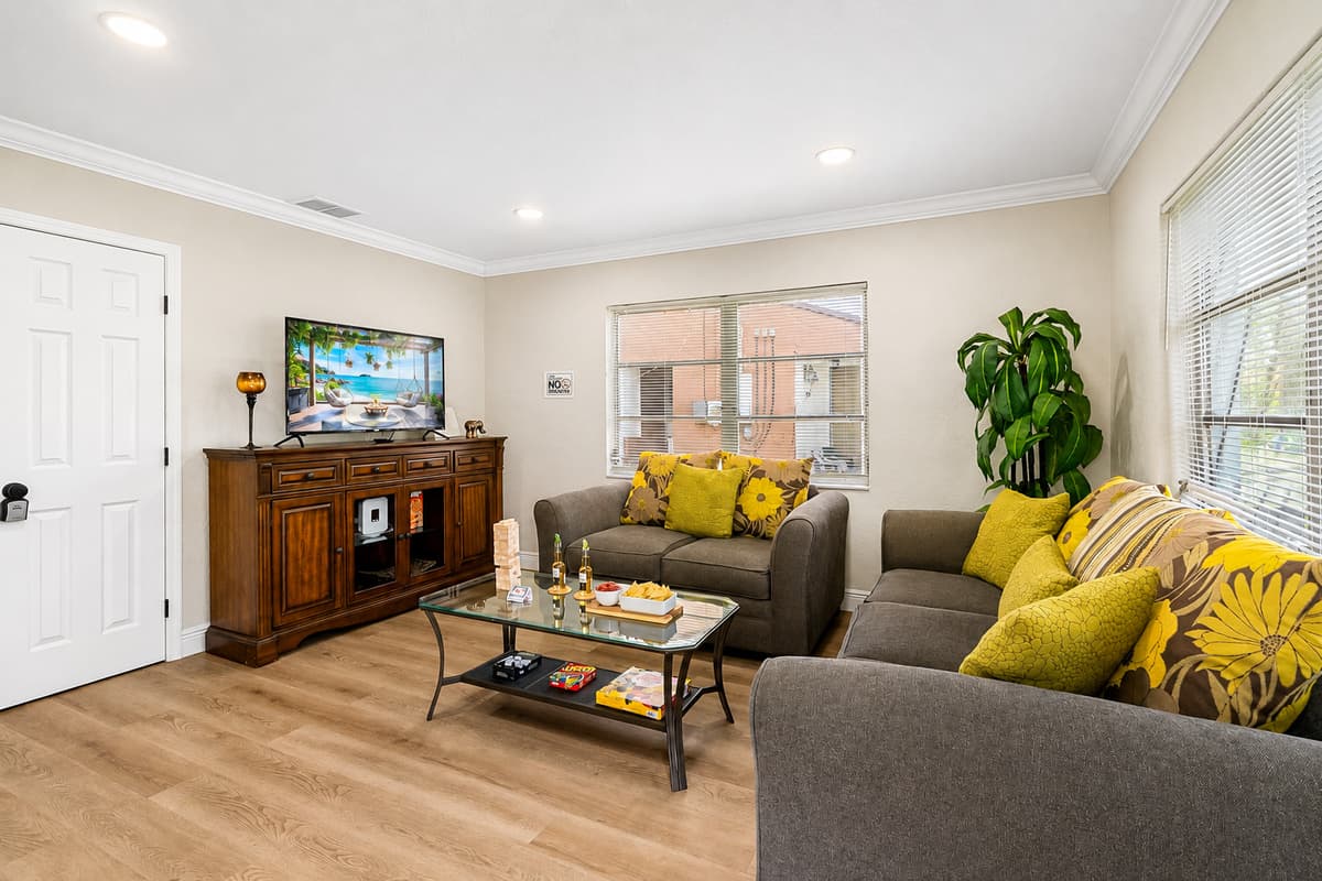 This inviting space is thoughtfully styled with a minimalist yet cozy aesthetic that immediately puts you at ease.
