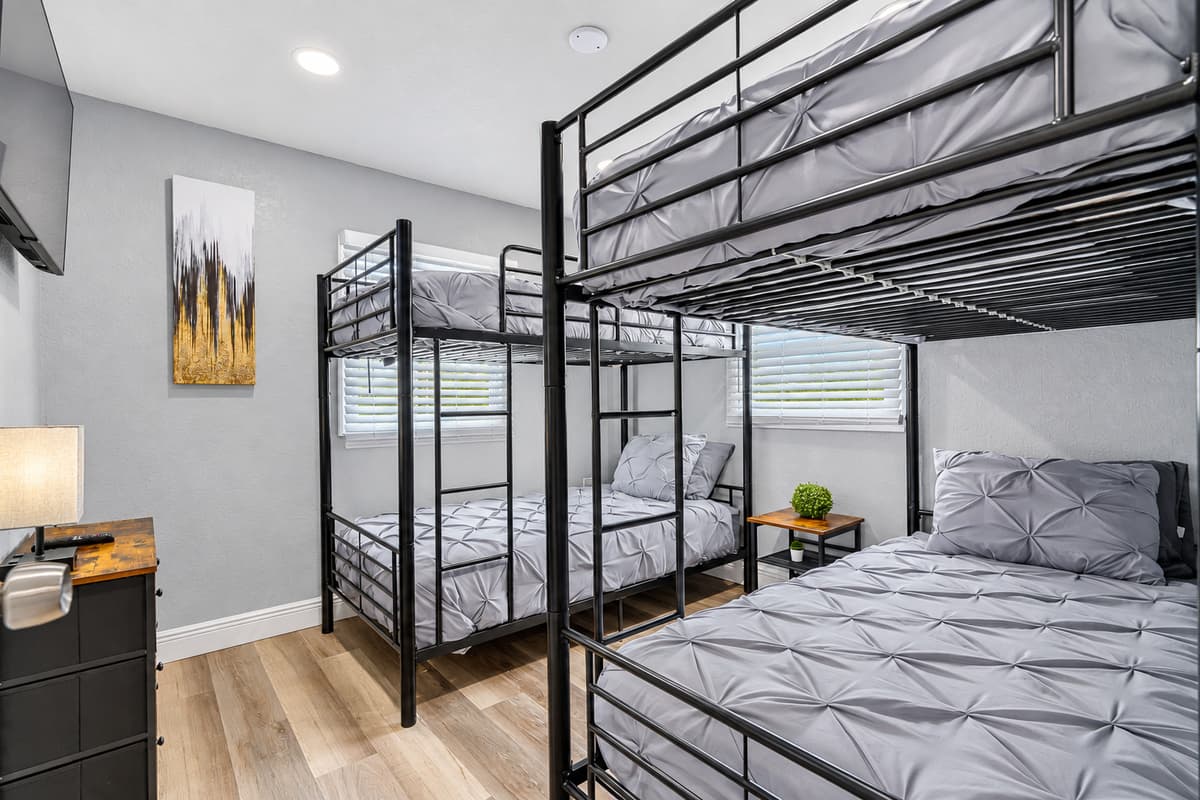 Four beds, one room, zero arguments. Two bunk beds give every kid a spot of their own. Lights out comes easier when everyone has their own bed. Fresh pintuck bedding on every mattress.