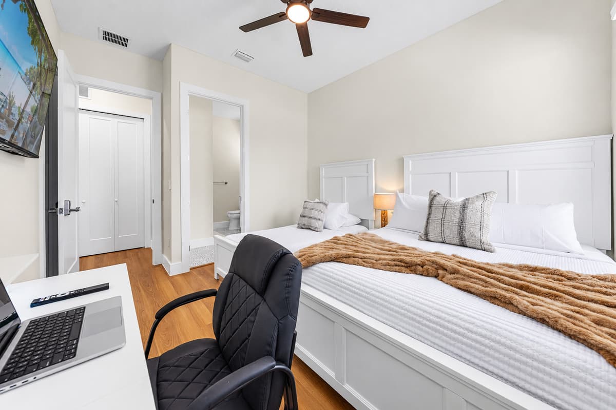 Curl up in the accent chair with a book or enjoy the ceiling fan's gentle breeze as you unwind.
