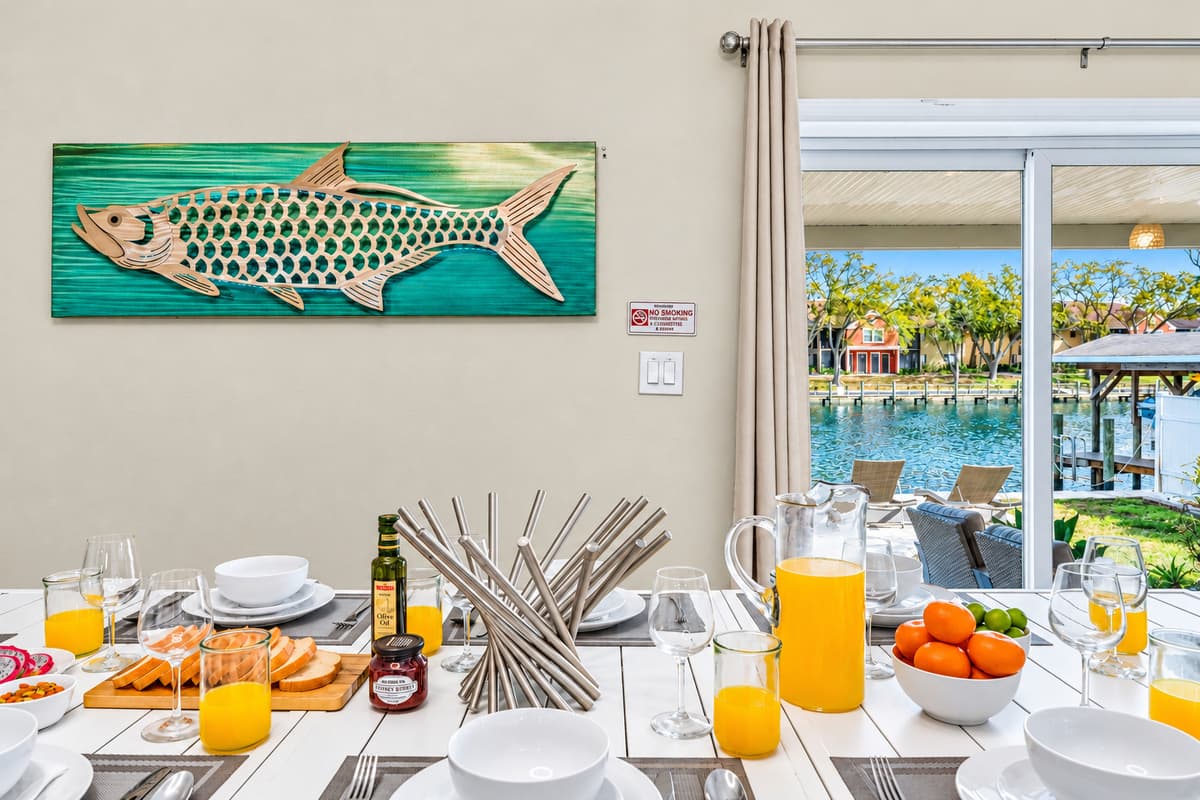 Spacious dining room with scenic water views and abundant natural light.