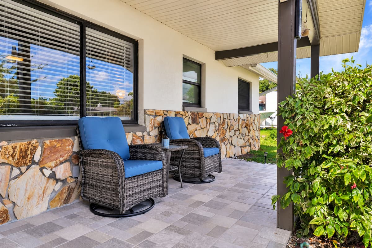 Picture yourself here at the end of the day: sandy feet up, cold drink in hand, kids still splashing out back, neighbors strolling past. The front seating is small, shaded and somehow the spot everyone keeps coming back to.