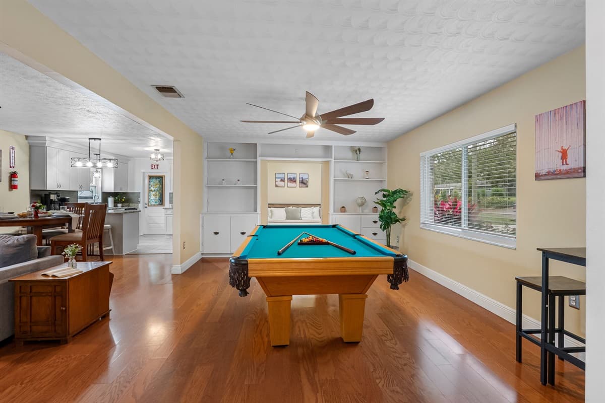 Perfect for game nights, this spacious entertainment area is ideal for all ages.