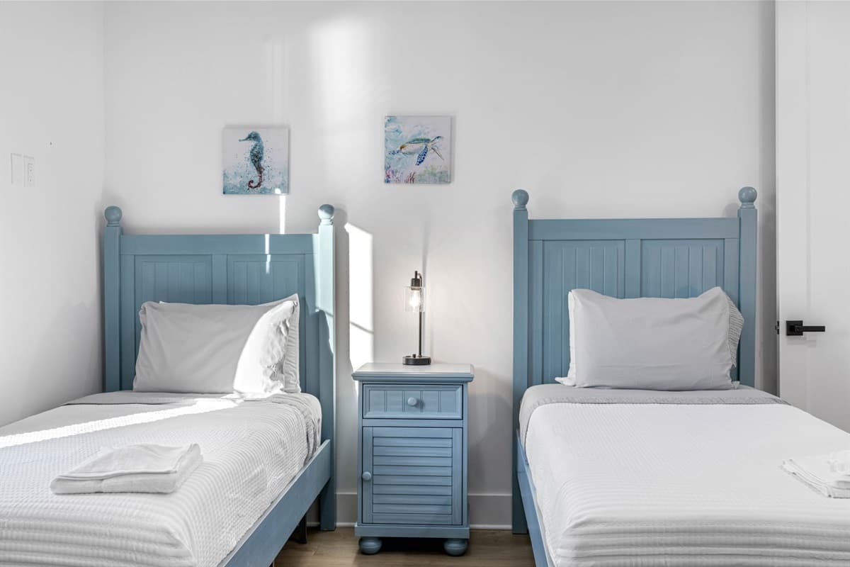 This bedroom offers two twin beds and is set up to provide a comfortable and relaxing environment for everyone.