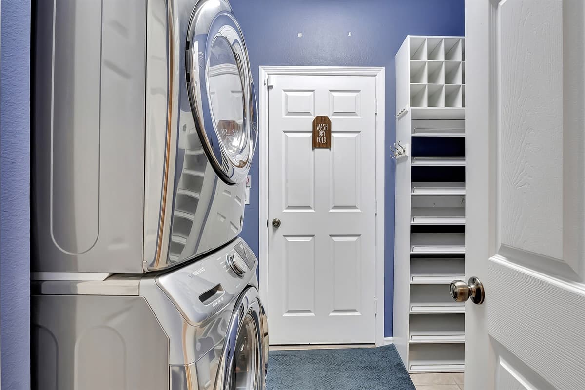 In our laundry room, you'll find a full washer and dryer setup along with essential laundry supplies.