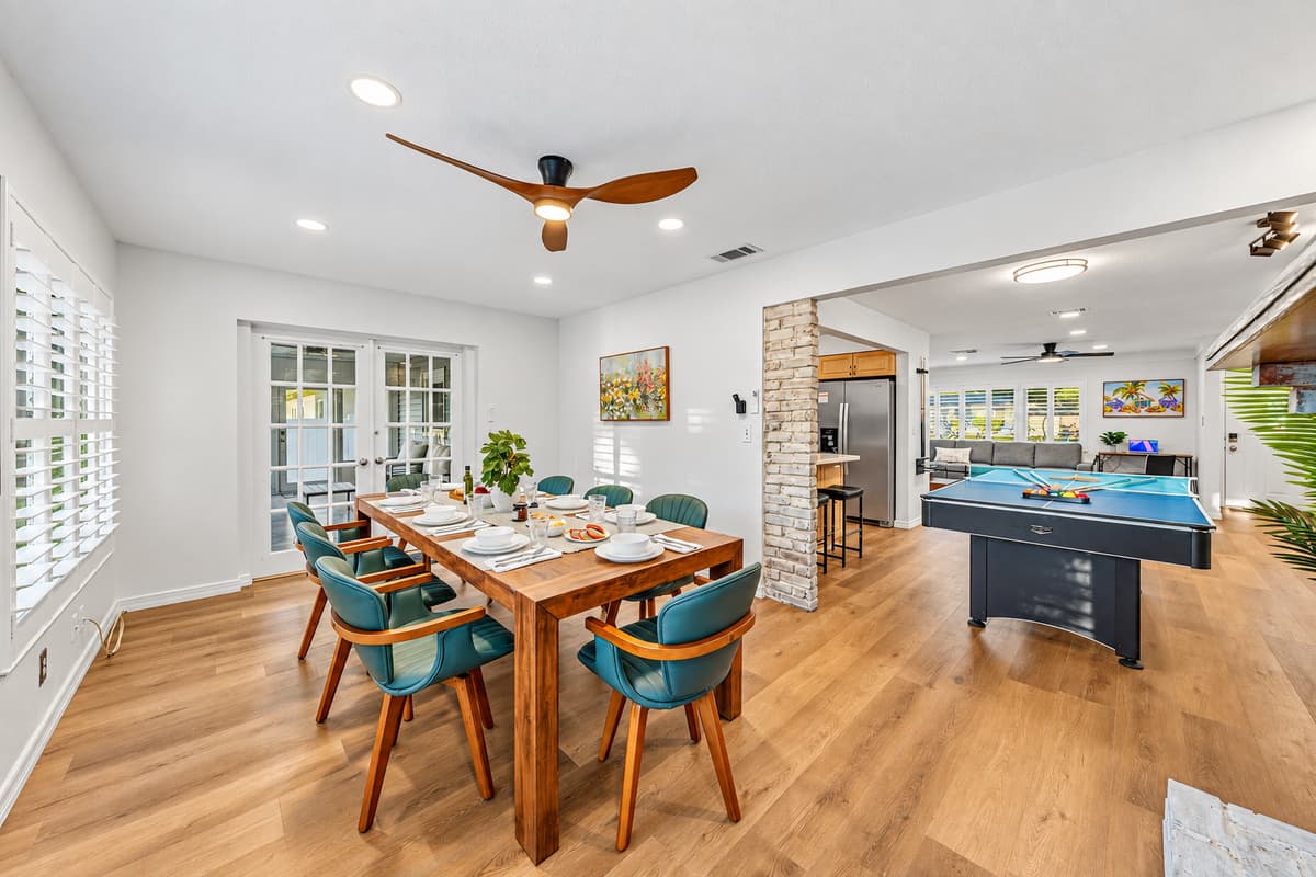 Open-concept dining and living area with plenty of seating for group meals and gatherings 
