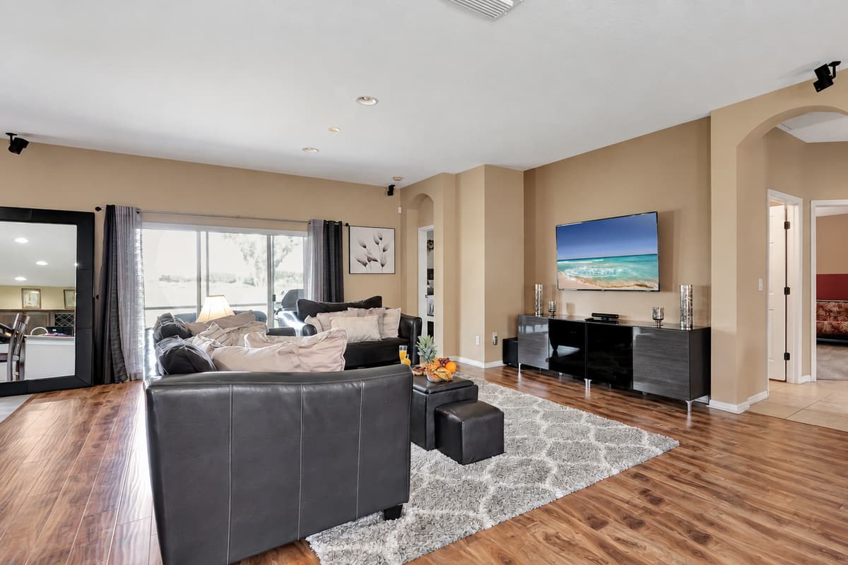 Oversized windows usher in natural light, framing the outside world like living works of art.