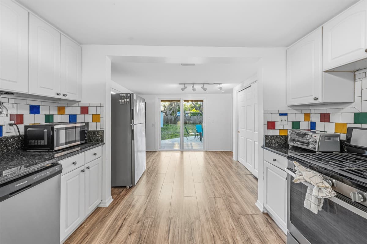 Wide kitchen view leading to the backyard—great for indoor-outdoor living.