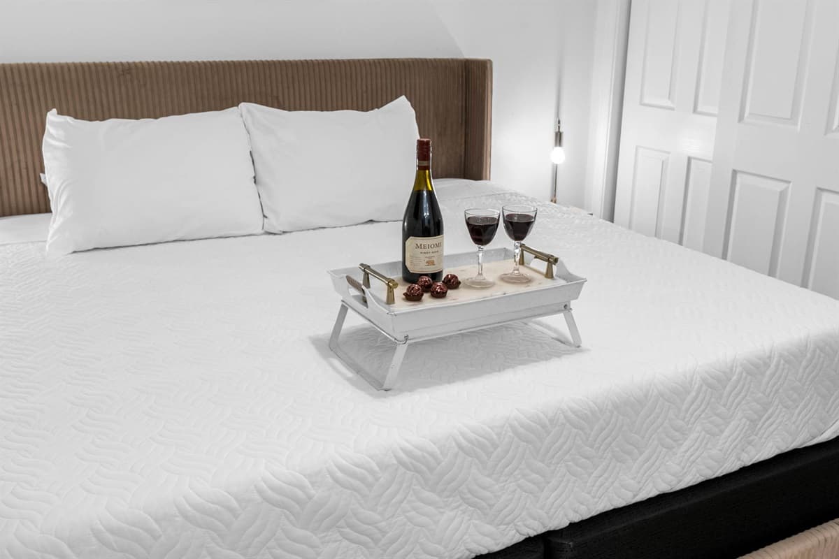 Enjoy the comfort of a king-size bed, smart TV, and private access to a full bathroom in this peaceful retreat. 