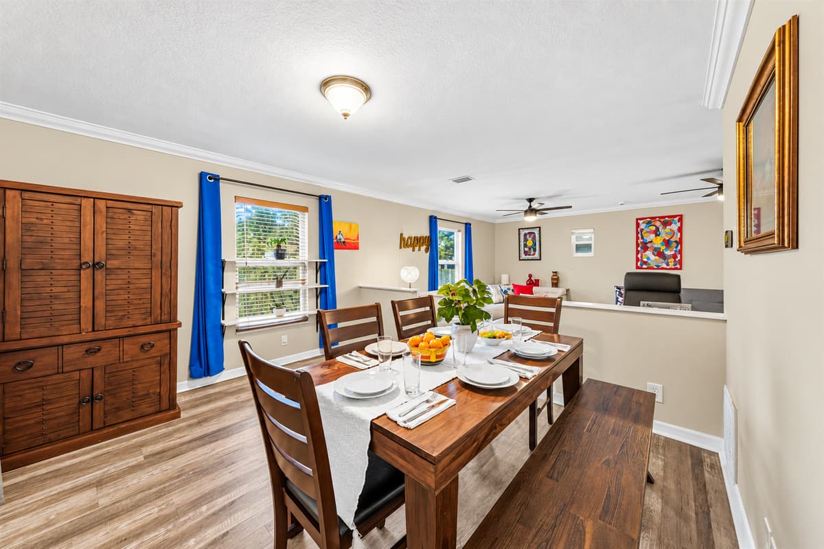 Large dining area with seating for the whole group, flowing seamlessly into the living space.