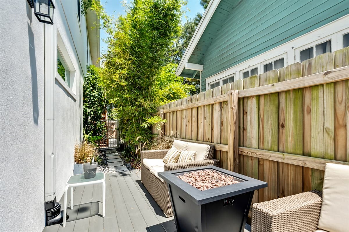 Surrounding the seating area, lush greenery and carefully curated plants enhance the natural beauty of the space, their vibrant colors and soothing presence creating a sense of peace and tranquility.
