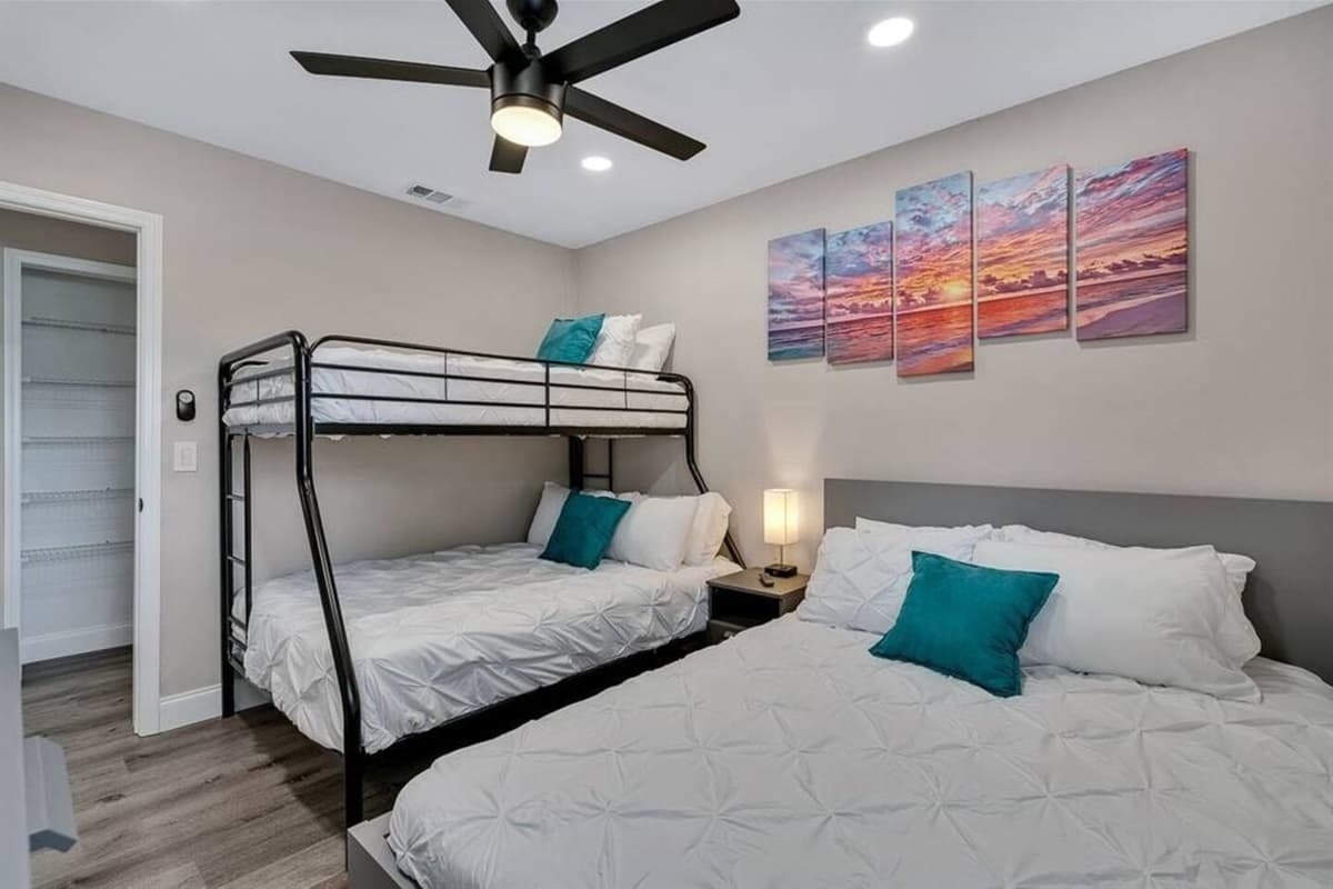Spacious bedroom with a comfortable huge bed and a single over twin bunkbed. This room also has its own TV. Feel at home in your home away from home. If you think you'd enjoy your trip to this property, send us a message now!