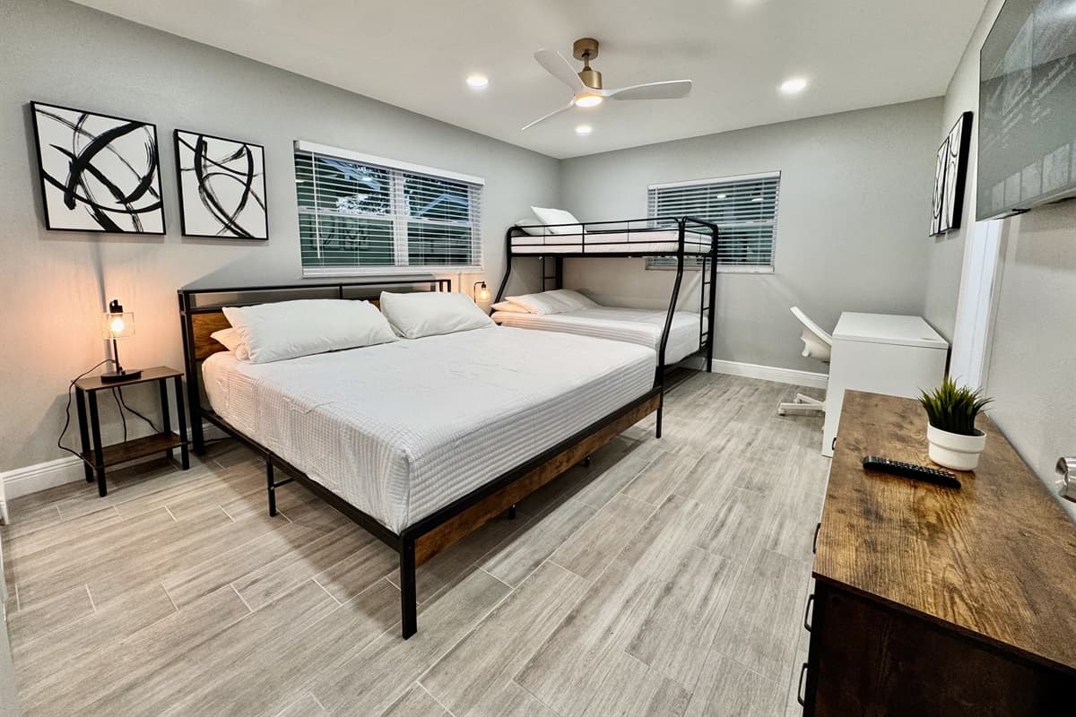 This bedroom is both functional and inviting, designed to accommodate the diverse needs of your group while maintaining the comfort and quality you expect.