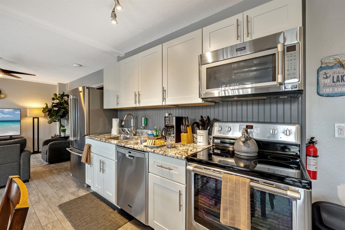 The kitchen is outfitted with a comprehensive collection of utensils and appliances.