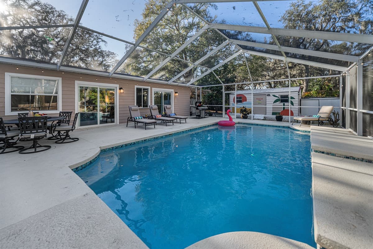 Enjoy seamless indoor-outdoor living with sliding glass doors leading to the expansive lanai and beautifully maintained pool area.