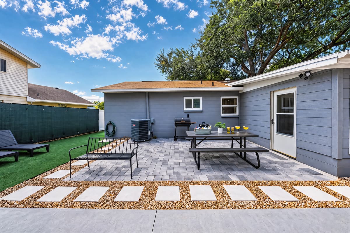 This modern grill and patio setup is primed for vibrant meals, intimate toasts, and unforgettable memories. Taste it!