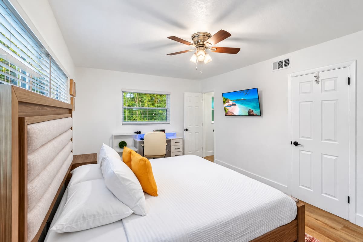 Soft tones, natural textures, and calming accents make this bedroom a cozy retreat after a day of Florida fun.