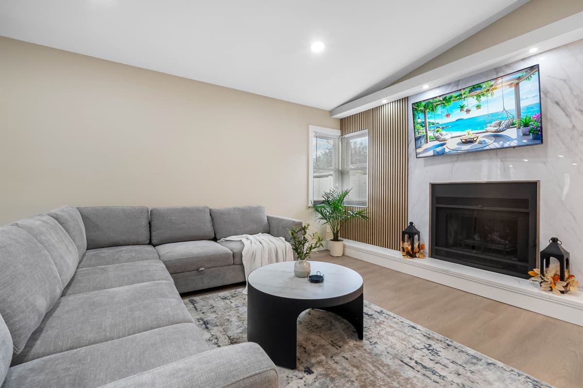 The family room features a convertible sleeper sectional sofa, providing an additional sleeping arrangement.
