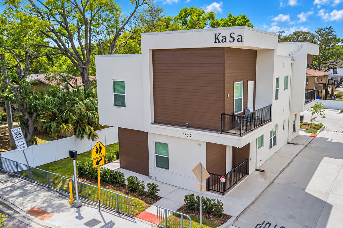 Modern design you'll spot from the corner. Clean white lines, warm wood accents, and a private balcony up top. Your 2nd-floor home sits in North Tampa's University district, with quick I-275 access to Downtown, St. Pete, and the beaches.