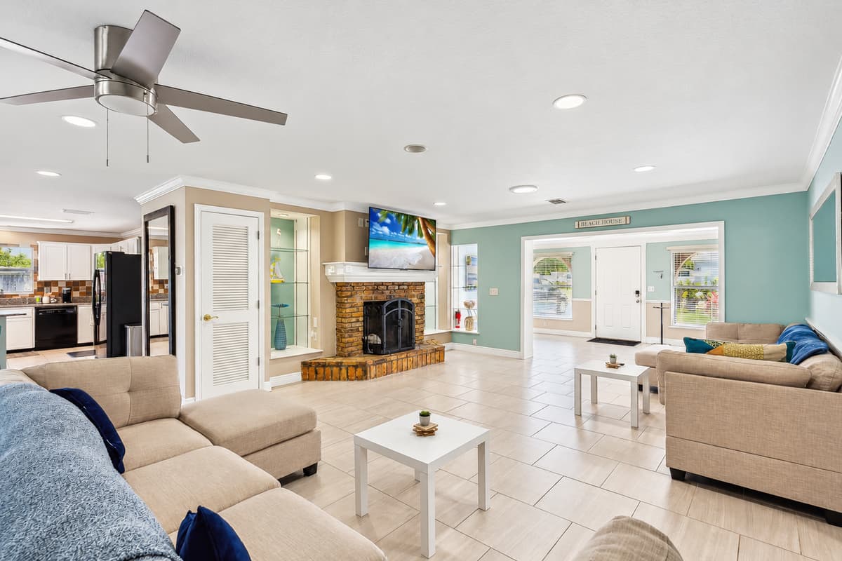 Living room with plenty of seating for the family and large UHD Smart TV