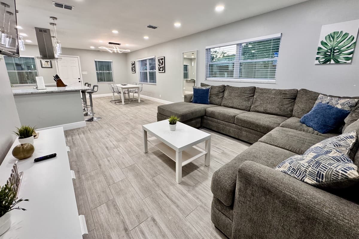 The open floor plan of the home creates a seamless connection between the living area, dining space, and kitchen.