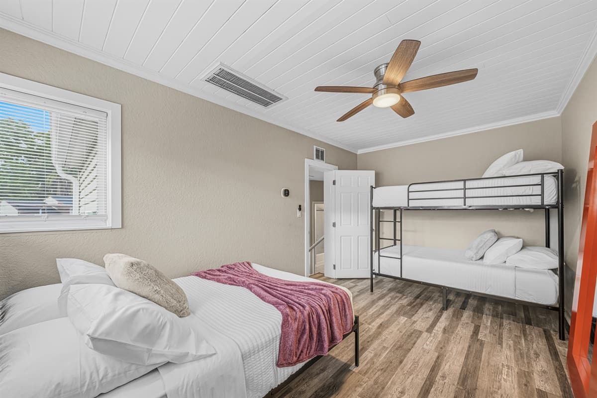 Spacious bunk room with multiple beds—ideal for families, kids, or group stays.