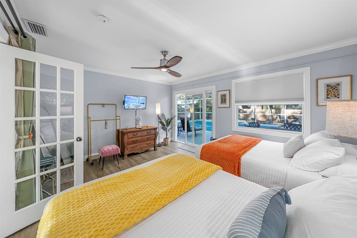 This thoughtfully designed bedroom features two double beds, providing comfort and flexibility for guests.