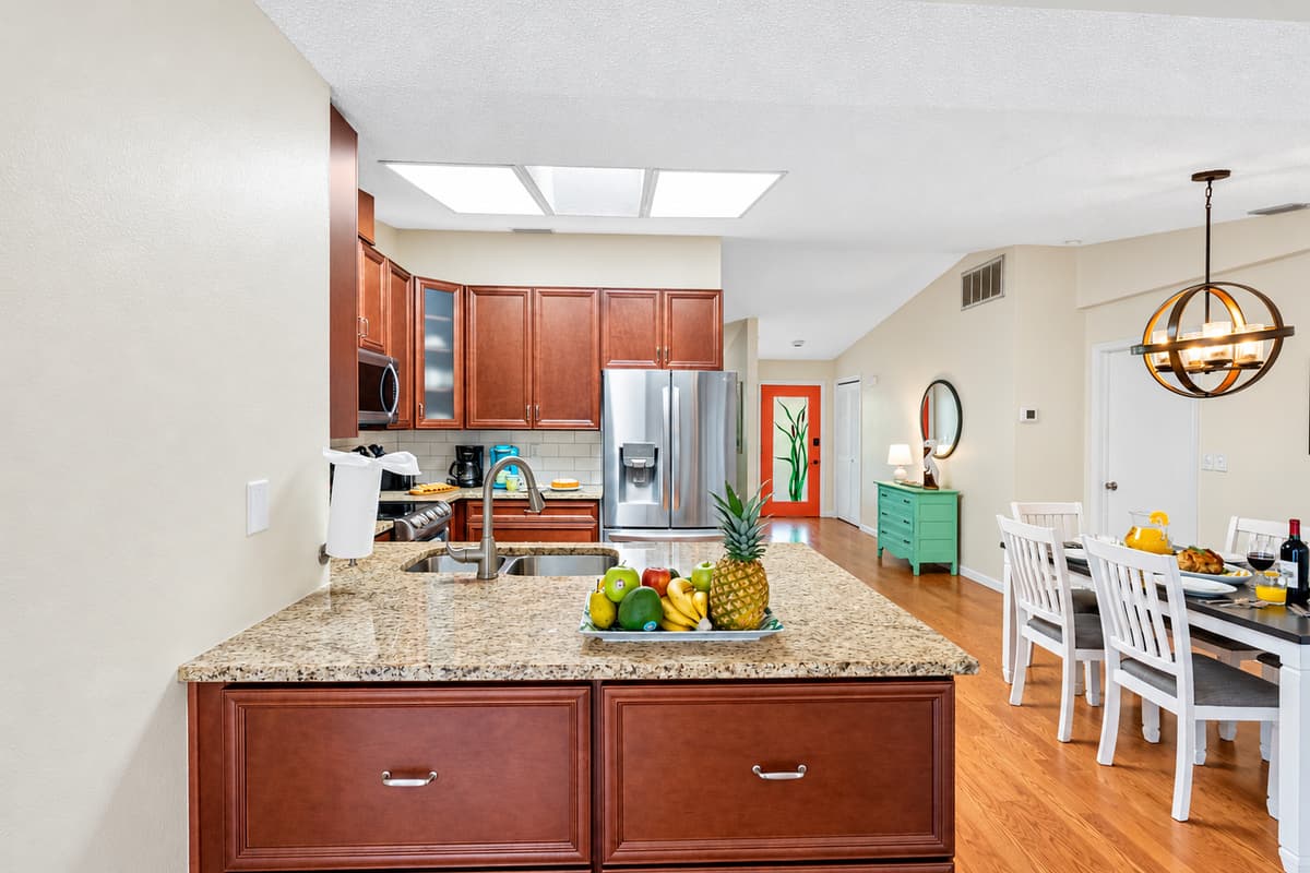 The fully equipped kitchen and the adjoining dining area create a harmonious environment that enhances the joy of cooking and the pleasure of shared meals.
